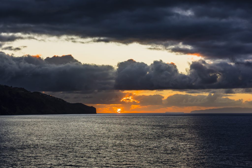 Sunrise and storm clouds over Funchal Harbour, Madeira, Portugal