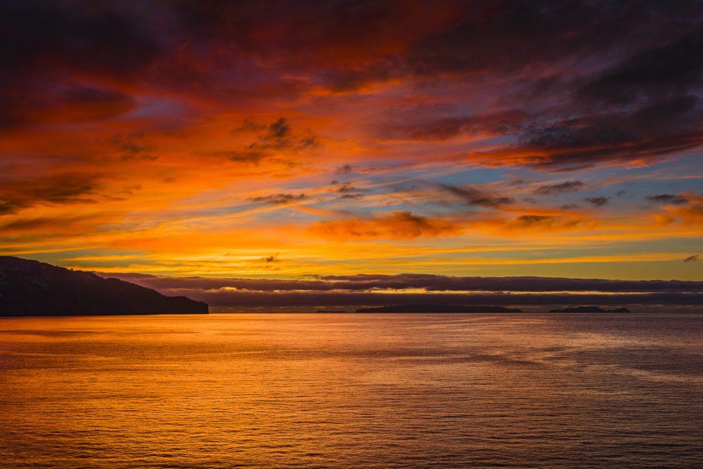 Sunrise and orange skies over Funchal Harbour, Madeira, Portugal