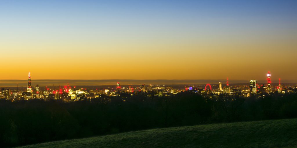 Sunrise and dawn in winter over the London skyline from The Shard to the BT Tower, taken from Hampstead Heath, London