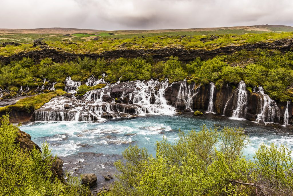 The multiple waterfalls through volcanic lava at Hraunfossar Falls, Iceland