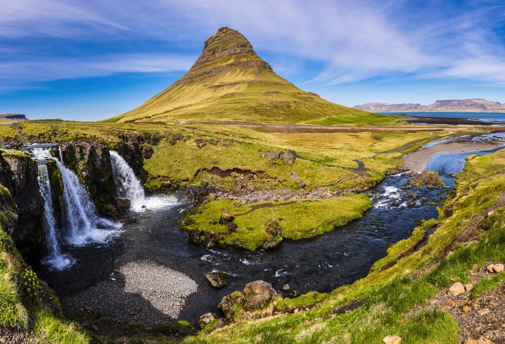 The famous Kirkjufell mountain and Kirkjufellsfoss waterfall on the Snaefellsnes Peninsula, Iceland