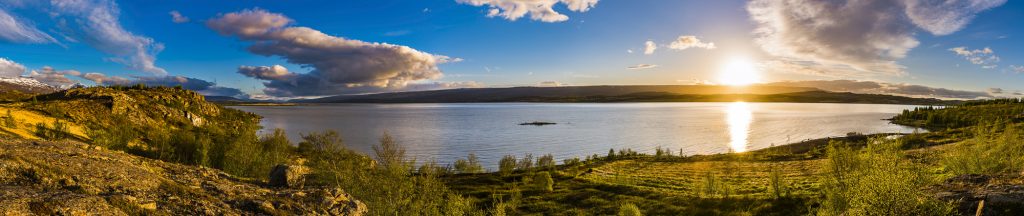 Panorama of the midnight sunset over Lagarfljot Lake, Iceland