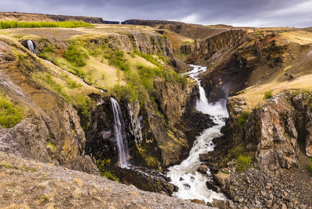 Waterfalls at Lower Hengifoss on the way to the main Hengifoss falls, Iceland
