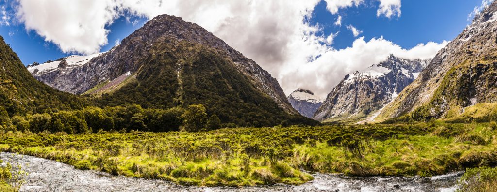 Panorama over the river and snowy waterfalls at Monkey Creek in Southland, South Island, New Zealand