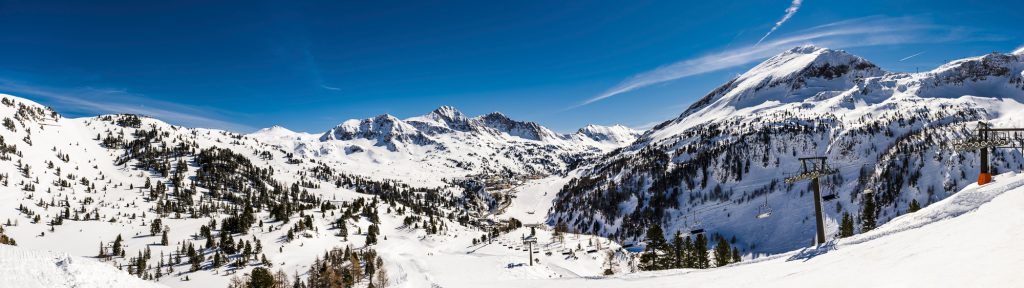 Panorama of the Alp mountains, looking down on the ski resort of Obertauern, Austria