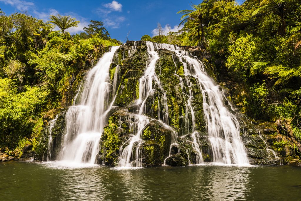 Long exposure of the river and waterfall at Owharoa Falls in Coromandel, Waikato, North Island, New Zealand