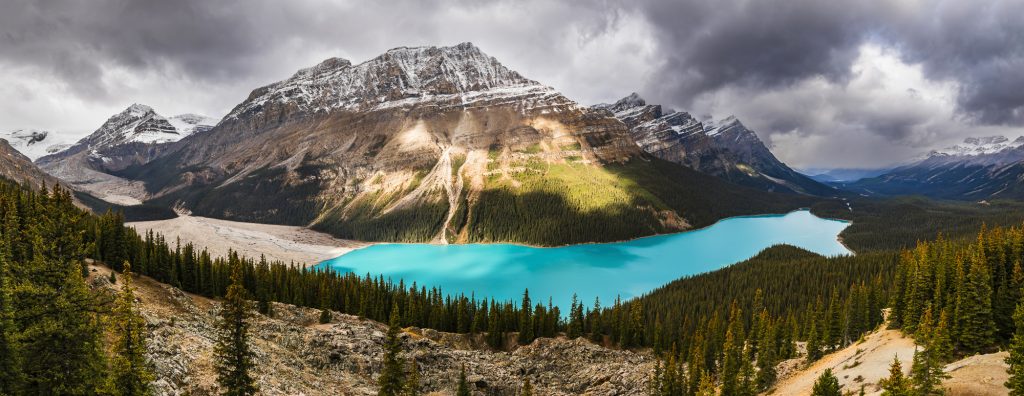 Snowy autumn panorama at Peyto Lake and glacier in the Rocky Mountains near Banff on the Icefields Parkway, Alberta, Canada