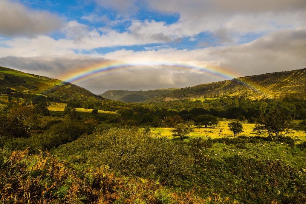 Autumn rainbow over the hills at Abergwyngregyn in Snowdonia, Wales