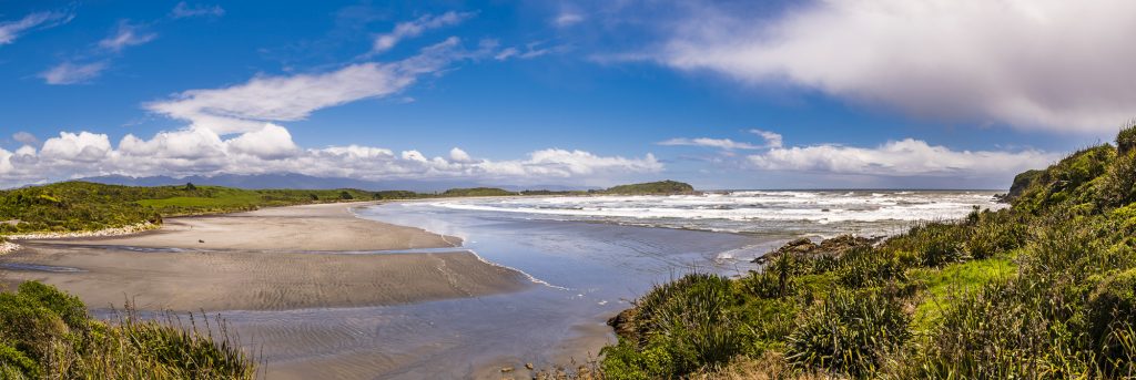 Panorama over the sea and beach at Tauranga Bay, near Westport, West Coast, South Island, New Zealand