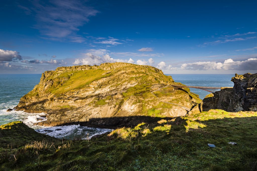 Early morning winter sunlight over Tintagel Island and castle, Tintagel, Cornwall