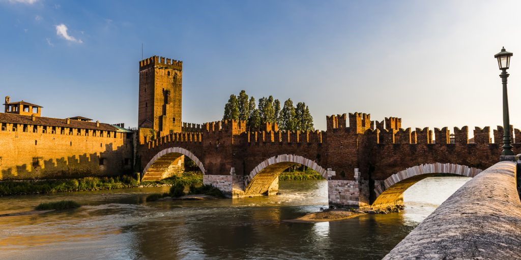 Sunset light on the Castelvecchio Bridge over the Adige River in Verona, Veneto, Italy