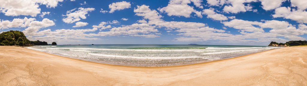 Panorama over the waves and sea at Whiritoa Beach in Coromandel, Waikato, North Island, New Zealand