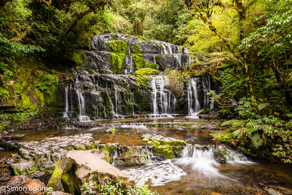 Long exposure on an autumn day at Purakaunui Falls waterfall in The Catlins, Otago, South Island, New Zealand
