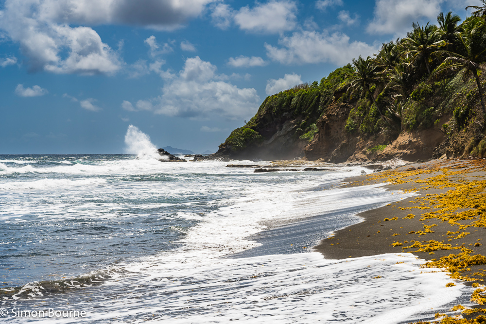 Atlantic Ocean waves and surf on the east coast at Biabou Beach, on the Caribbean island of St Vincent and the Grenadines