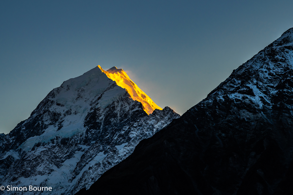 Early morning autumnal landscape with orange sunrise light on Mount Cook (Aoraki), Canterbury, South Island, New Zealand