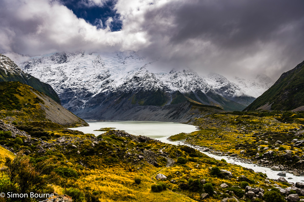 Autumnal snowy landscape over the Mueller Lake and Glacier, Hooker River and surrounding mountains in the Mount Cook National Park, Canterbury, South Island, New Zealand