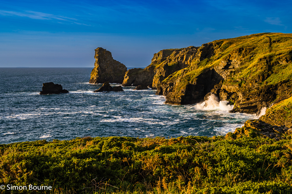 Sunset and Atlantic Ocean surf at the Rocky Valley clifftops, between Tintagel & Boscastle, Cornwall