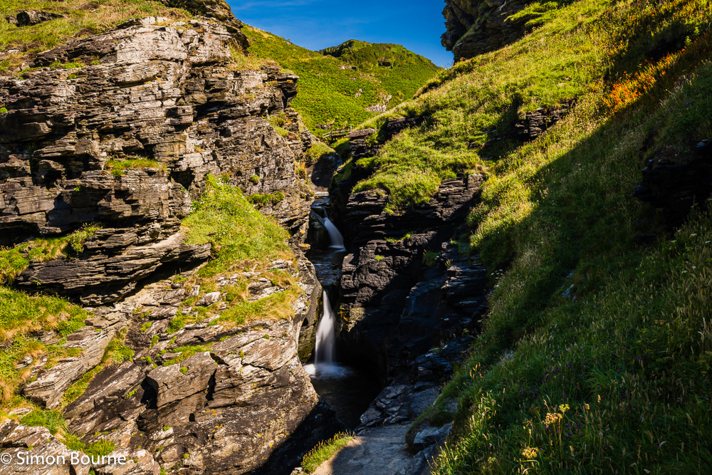 Long exposure in late afternoon summer sun at the Rocky Valley waterfalls, between Tintagel & Boscastle, Cornwall