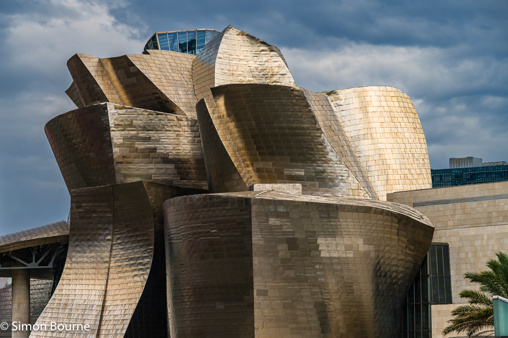 Late afternoon setting golden sun on the titanium cladding of the Guggenheim Museum in Bilbao, The Basque Country, Northern Spain
